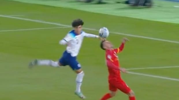 Rico Lewis (left) pictured moments after he apparently fouled Bojan Miovski during England's Euro 2024 qualifiers against North Macedonia in November 2023